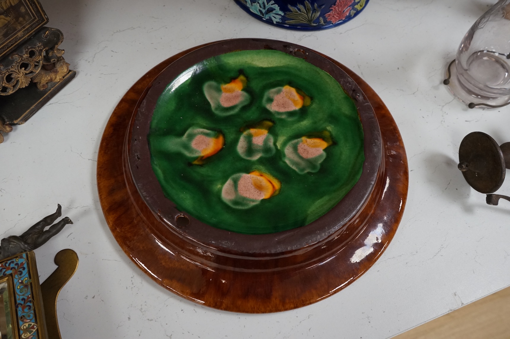 A Victorian majolica cheese dome decorated with fish and seaweed, and a later dish, dome 23cm high, 23cm diameter, dish 24cm internal diameter